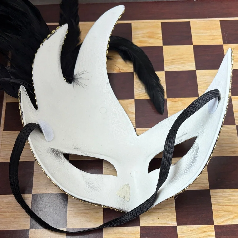 Elegant Black and Gold Masquerade Mask with Feathers